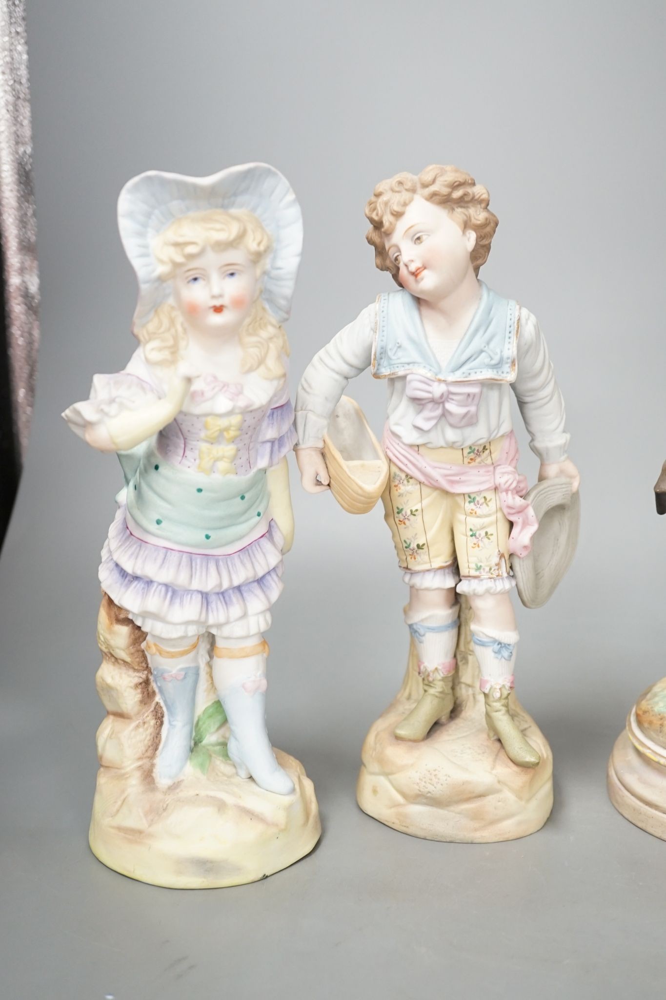 A pair of French bisque Marly horse groups and two pairs of French porcelain figures 27cm